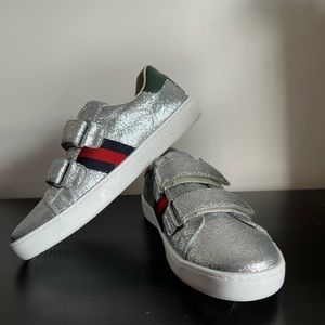 Kids silver glitter Gucci sneakers.